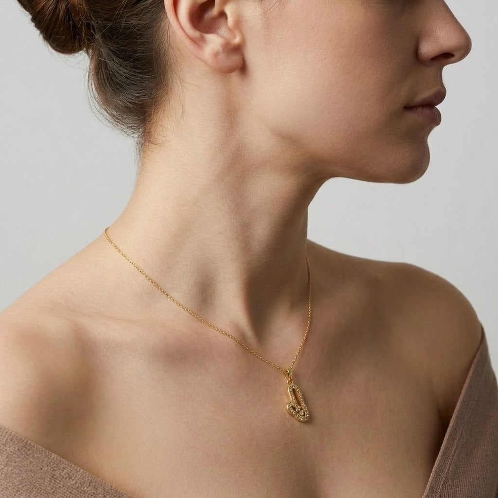 Open heart pendant in 9K yellow gold formed by two curved lines set with diamonds