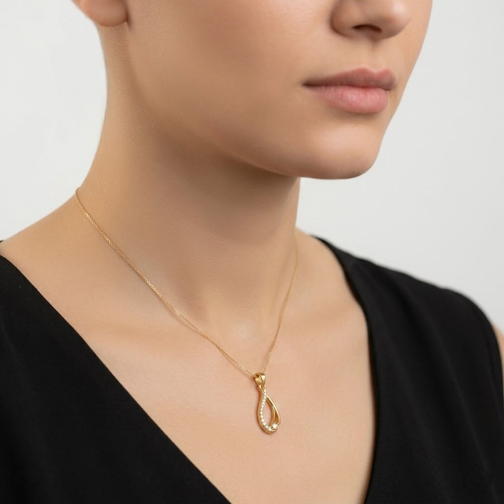 Graceful Flowing Teardrop Motif diamond gold pendant