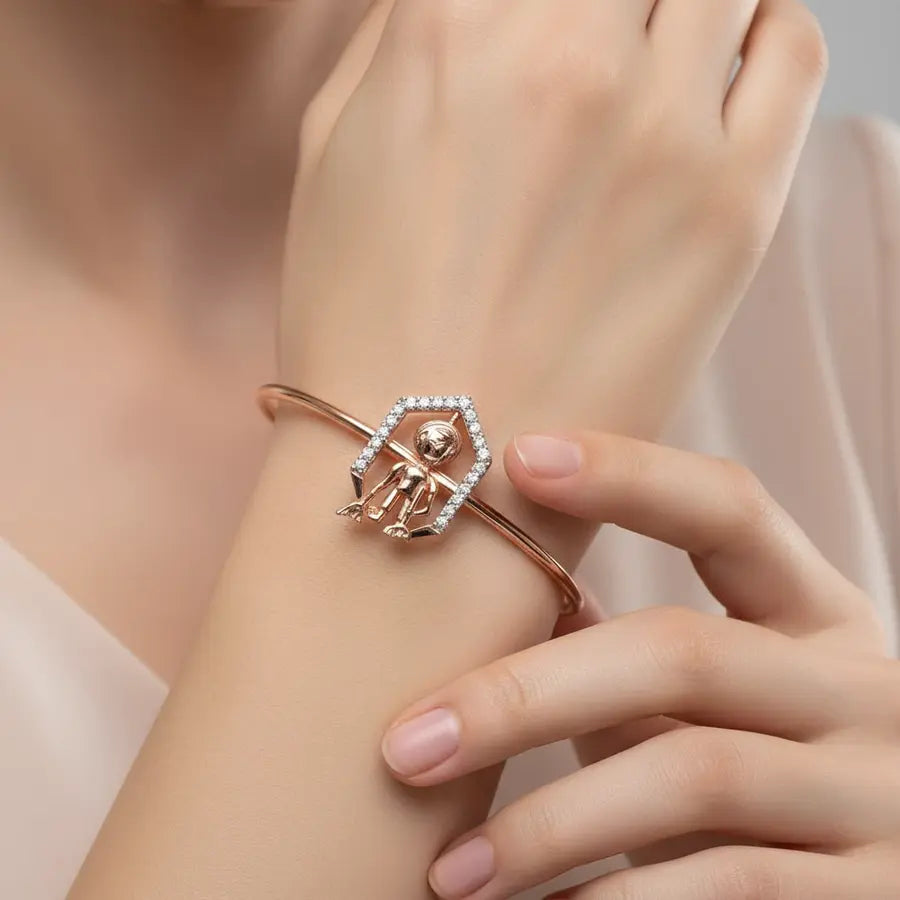 Grace in Motion Gold Bangle