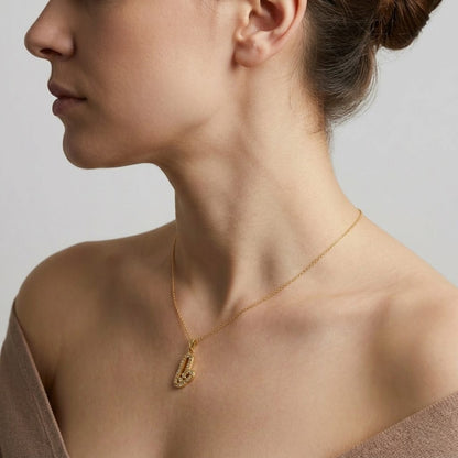 Open heart pendant in 9K yellow gold formed by two curved lines set with diamonds