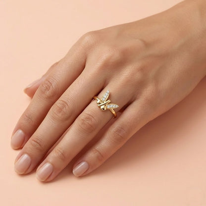 Butterfly Beauty ring in 9K yellow gold with crossed wing shapes set with small diamonds