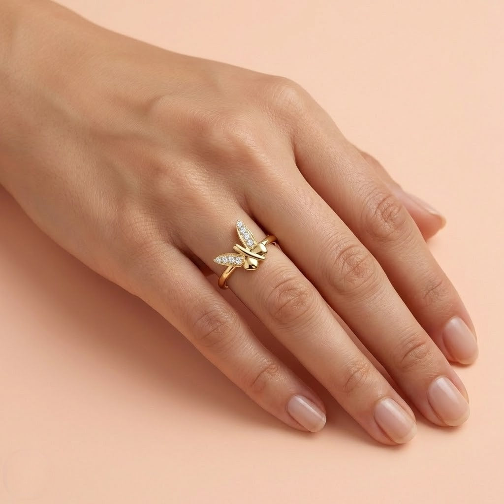 Butterfly Beauty ring in 9K yellow gold with crossed wing shapes set with small diamonds