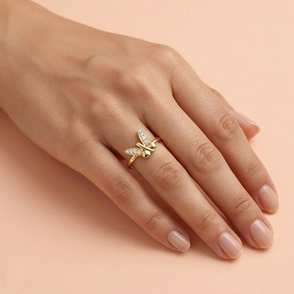 Butterfly Beauty ring in 9K yellow gold with crossed wing shapes set with small diamonds