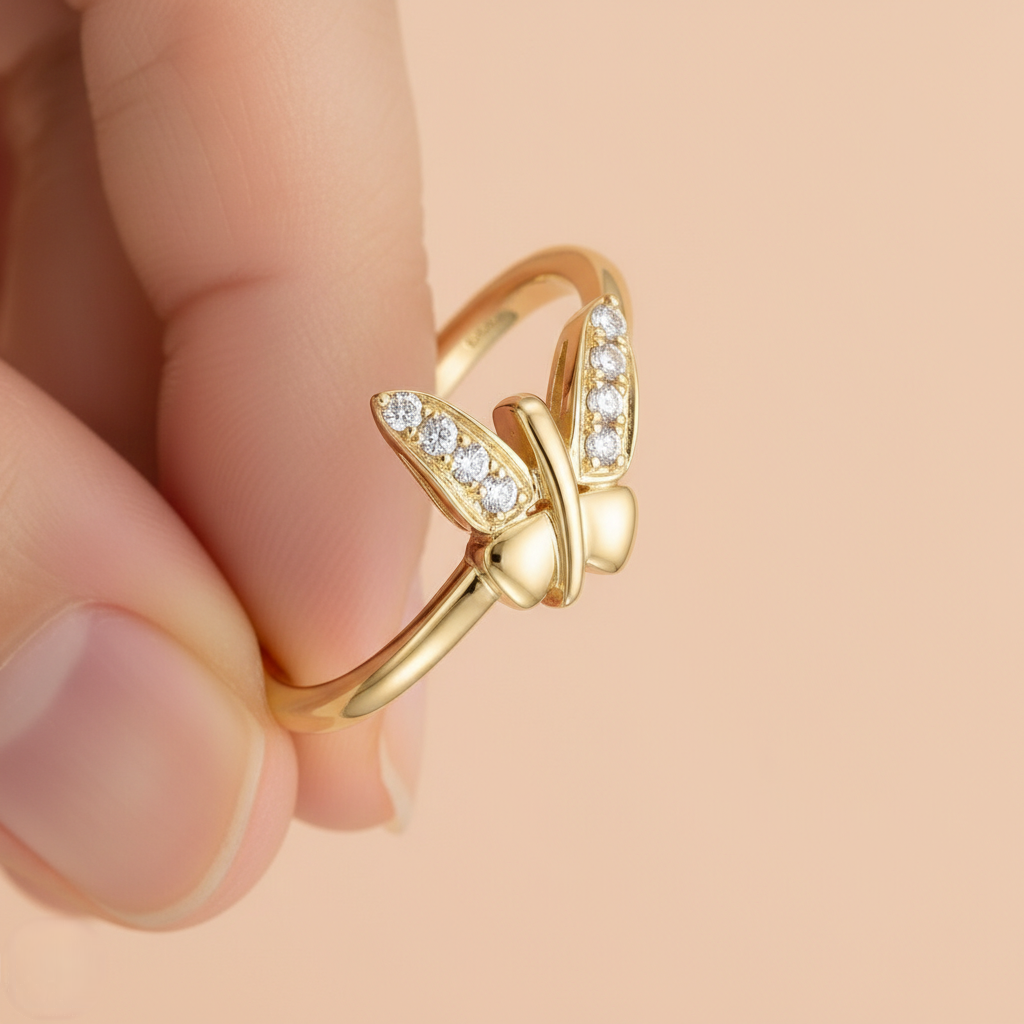 Butterfly Beauty ring in 9K yellow gold with crossed wing shapes set with small diamonds