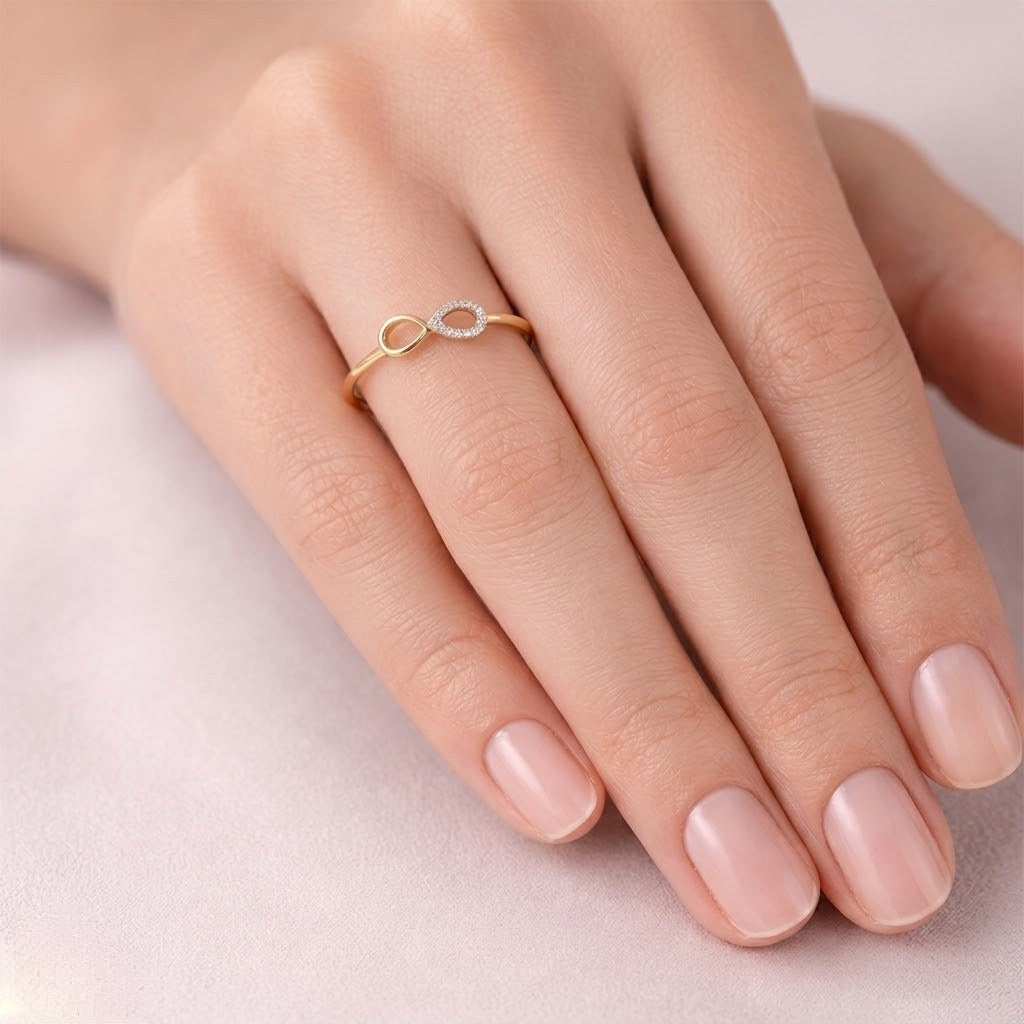 Infinity teardrop motif diamond gold ring