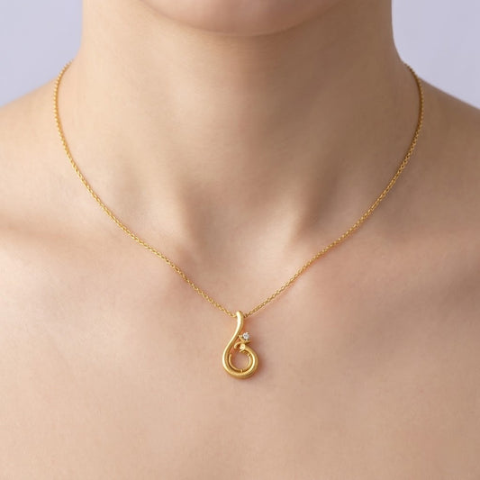 Graceful swirl motif diamond gold pendant