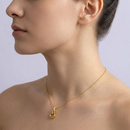 Graceful swirl motif diamond gold pendant
