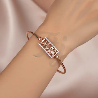 Butterfly's Gentle Touch Gold Bangle