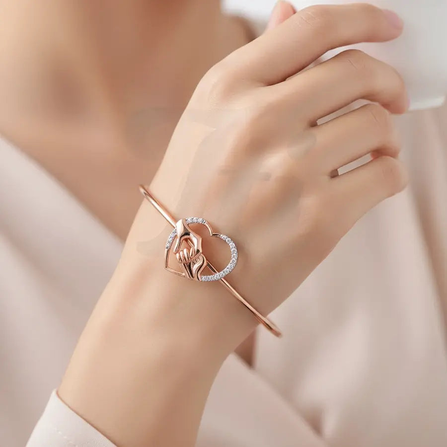 Holding Hands Gold Bangle