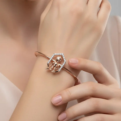 Grace in Motion Gold Bangle