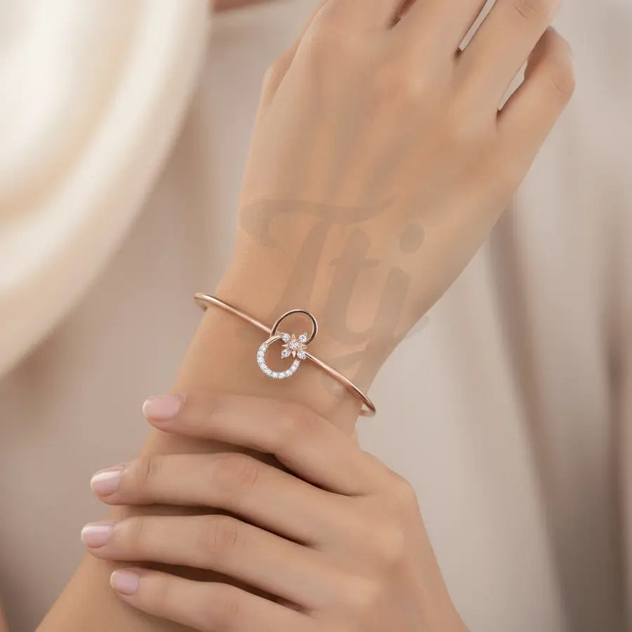 Flower motif with sparkling stone Gold Bangle
