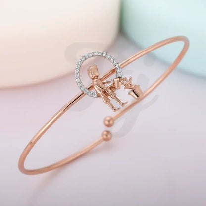 Man watering plants Gold Bangle
