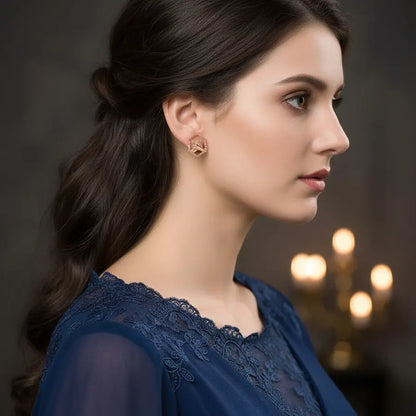 Twin Hands Holding Gold Earrings